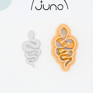 May include: Two 3D printed cookie cutters shaped like snakes. The cutters are made of PLA plant-based plastic and are non-toxic. One cutter is white and the other is orange.