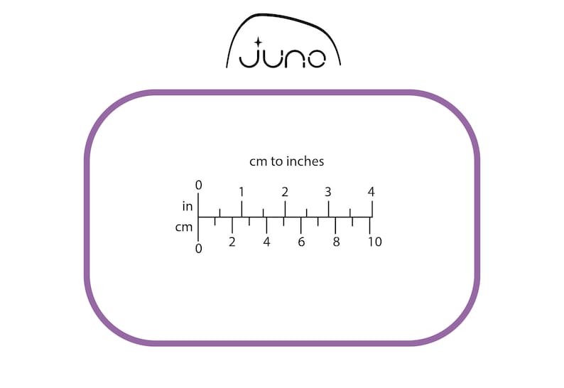 May include: A ruler with a purple border and black markings showing centimetres and inches. The ruler is labelled "cm to inches" and has markings from 0 to 10 centimetres and 0 to 4 inches.