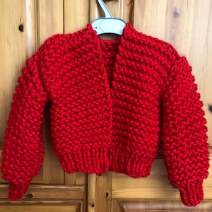 Child’s handmade super chunky knit red cardigan