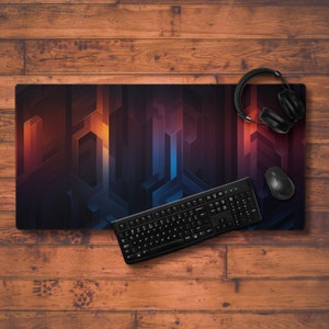 May include: A black and blue geometric design mousepad with a black keyboard and a black headset on a wooden surface.