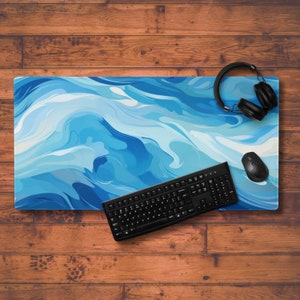 May include: A blue and white abstract swirl design desk mat with a black keyboard and mouse on top. The desk mat is on a wooden surface.