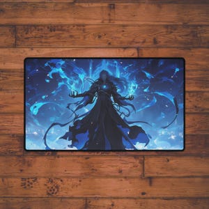 May include: A rectangular mousepad featuring a fantasy illustration. A figure in a dark robe with long hair is surrounded by swirling blue energy. The artwork has a detailed, digital painting style, with a black border.