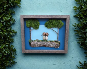 Framed Pebble Art - Acorn Hat Couple with teal background