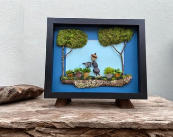 Framed Pebble Art - Outdoor Gardener with teal background