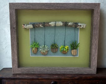 Framed Pebble Art - Hanging Plants with green leaf background