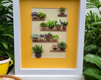 Framed Pebble Art - Plants on Shelves with yellow background