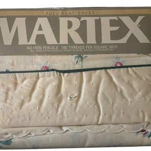 May include: A full flat sheet set by Martex, packaged in clear plastic. The sheet is cream-colored with a floral pattern in pink and green. The packaging reads "NO-IRON PERCALE 180 THREADS PER SQUARE INCH".