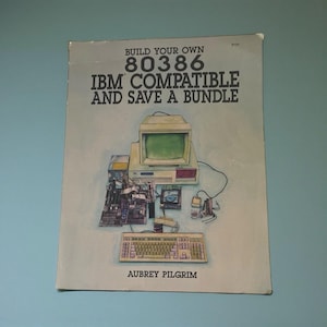 May include: A book cover with the title "BUILD YOUR OWN 80386 IBM COMPATIBLE AND SAVE A BUNDLE" featuring an illustration of a computer and its components. The author's name, Aubrey Pilgrim, is at the bottom.