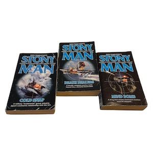 May include: Three paperback books from the "Stony Man" series by Don Pendleton. The covers feature action scenes and the titles "Cold Snap", "Death Dealers", and "Mind Bomb". The books are set against a white background.