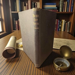 May include: A vintage book titled "Practical Ship Production" with gold lettering, a rolled map, and a brass compass on a wooden surface. The book has a dark brown cover and is standing upright. A bookshelf filled with books is in the background.