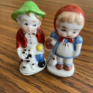 Miniature porcelain boy snd girl figurines made in occupied Japan