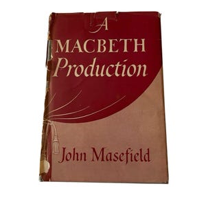 May include: A vintage book cover for "A Macbeth Production" by John Masefield. The cover features a maroon background with white text and decorative lines. The book's edges show signs of wear.