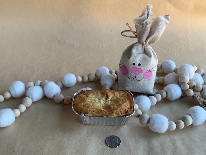 Gluten-Free Mini Mandarin Cardamom Pound Cake with Quarter for size reference.