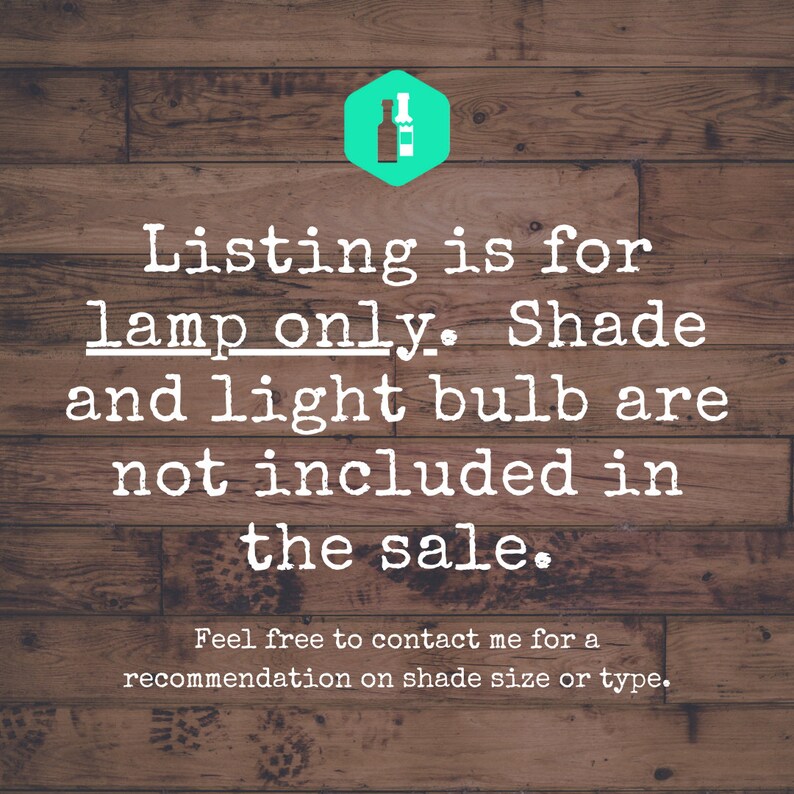 May include: Text on a wooden background states "Listing is for lamp only. Shade and light bulb are not included in the sale." A green hexagon with a bottle and lightbulb icon is in the top right corner. The text encourages contacting for shade recommendations.