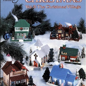 May include: A plastic canvas Christmas village book cover. The cover features various miniature houses with snow and evergreen trees. The title "CHRISTMAS" is prominently displayed, with the text "Vol. 3: The Christmas Village" below. The book is by Don Franz Meier.