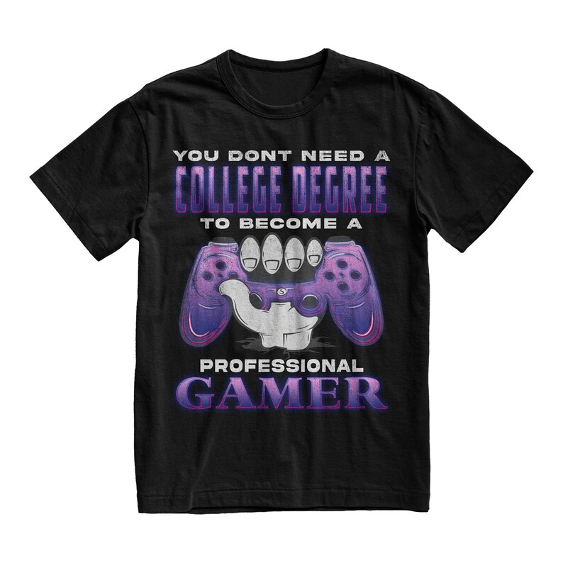 May include: Black t-shirt with a purple and white graphic of a hand holding a video game controller. The text on the shirt reads "You don't need a college degree to become a professional gamer."