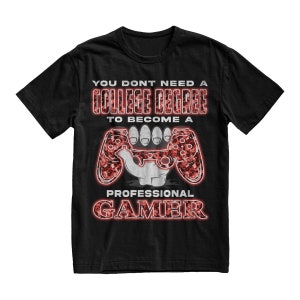 May include: Black t-shirt with a red and white graphic design. The graphic features a video game controller and the text "You don't need a college degree to become a professional gamer".