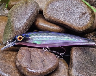 4" minnow jerkbait.  Black / holographic