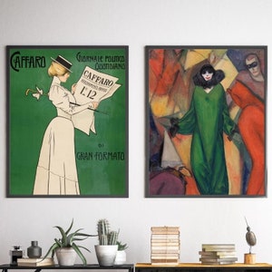 May include: Two framed images hanging on a white wall. The image on the left is a vintage advertisement for the Italian newspaper "Caffaro" with a woman in a white dress and a hat holding a newspaper. The image on the right is a painting of a woman in a green dress standing in a crowd of people.