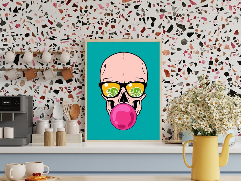 May include: A framed illustration of a pink skull wearing sunglasses with a blue and green wave pattern reflected in the lenses. The skull is blowing a pink bubble.