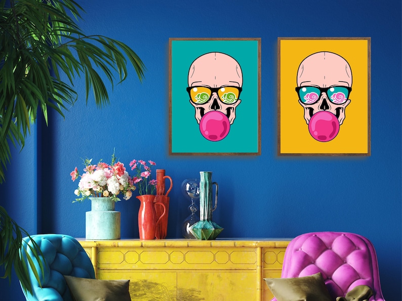 May include: Two framed illustrations of a skull wearing sunglasses and blowing a bubble. The skull in the left frame is on a turquoise background, and the skull in the right frame is on a yellow background.