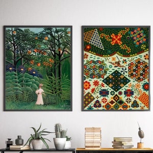 May include: Two framed art prints, one depicting a woman walking through a lush green jungle with orange fruit trees, the other a colorful abstract geometric pattern with a bird in the center.