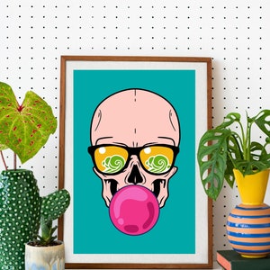 May include: A framed print of a cartoon skull wearing sunglasses with a pink bubblegum in its mouth. The background is a teal blue color.