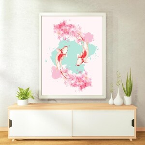 May include: A framed watercolor painting of two koi fish swimming in a circle with pink cherry blossoms. The background is a light blue watercolor wash.