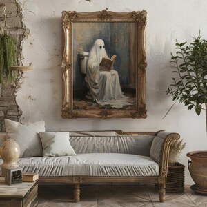 May include: A framed painting of a ghost sitting on a toilet and reading a book. The ghost is wearing a white sheet and has a book in its hands. The painting is set in a bathroom with a white toilet and a tiled floor.