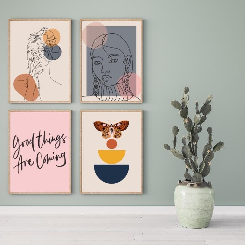 May include: Four framed prints with abstract designs. The top left print features a line drawing of a woman with a flower in her hair. The top right print features a line drawing of a woman with a geometric design behind her. The bottom left print features the text "Good things are coming". The bottom right print features a butterfly with geometric shapes behind it.