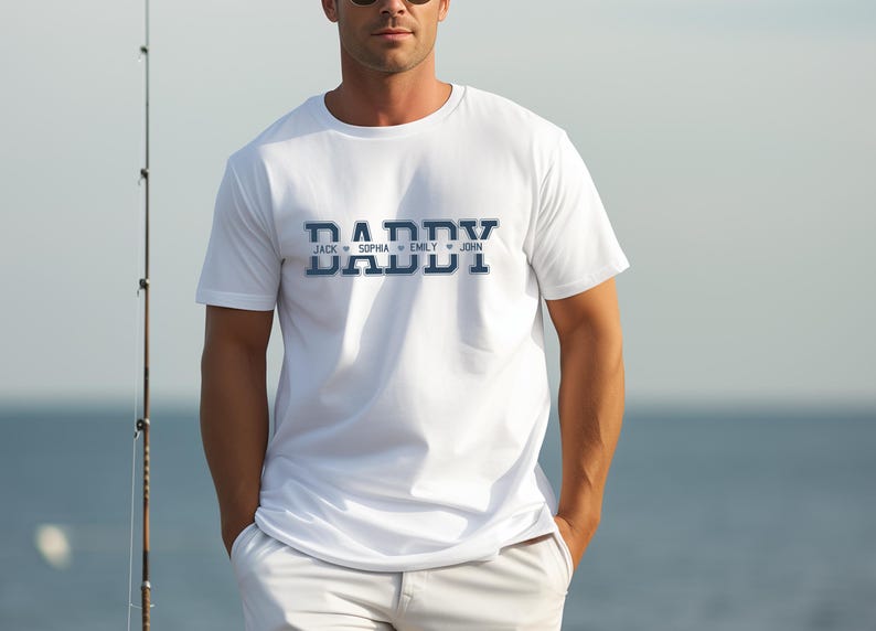 May include: White t-shirt with a blue "Daddy" graphic and the names "Jack", "Sophia", "Emily", and "John" printed below.