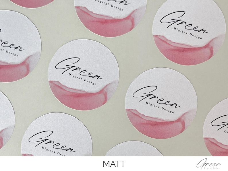 May include: A collection of circular matte stickers featuring a white background with a soft pink watercolor wash at the bottom. Each sticker displays the black text Green Digital Design in a combination of script and sans-serif typography.