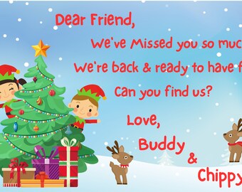 May include: A Christmas card featuring two elves hiding behind a decorated Christmas tree with presents underneath. The card reads "Dear Friend, We've Missed you so much! We're back & ready to have fun! Can you find us? Love, Buddy & Chippy"