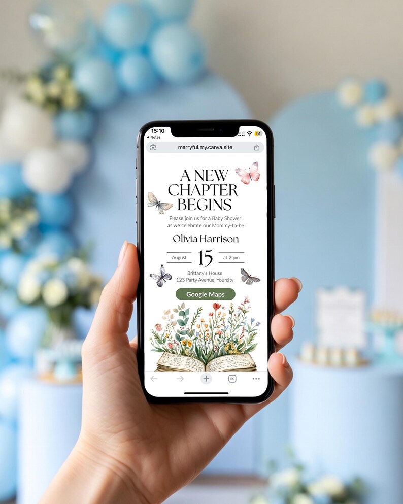May include: A mobile phone screen shows a baby shower invitation with the text "A New Chapter Begins." The invitation includes butterfly and floral designs. The date is August 15th at 2 pm. The phone is held in a hand, with a blurred background of blue and white decorations.