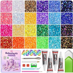 May include: A bedazzling kit with 40,000 rhinestones in various colors, including pink, white, gold, purple, and blue. The kit includes glue, tools, and a container with the text "Bedazzling Kit PERFECT FOR ANY SURFACE".