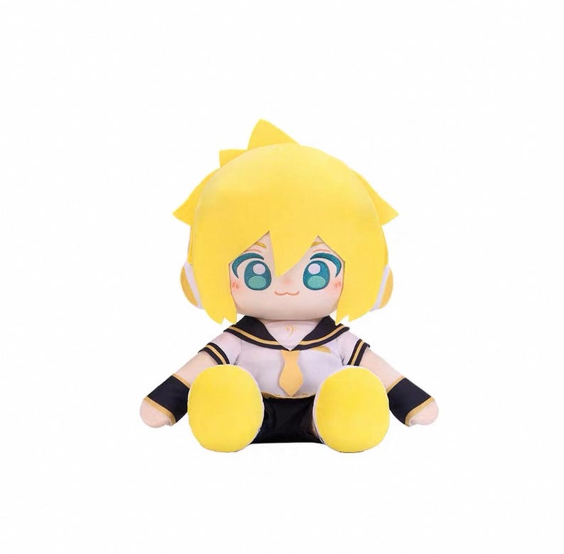 May include: A plush doll of a character with yellow hair and large blue eyes. The doll wears a white sailor-style uniform with black and gold accents. The doll has yellow hands and feet and is sitting.