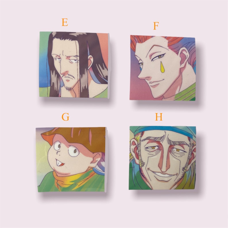 May include: Four colourful square stickers featuring characters from the anime Hunter x Hunter. The stickers feature a man with long black hair, a man with red hair, a young boy with a brown hat, and an older man with a blue hat.