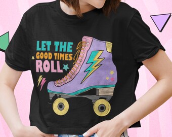 May include: Black t-shirt featuring a retro roller skate graphic. The skate is purple, teal, and yellow with a lightning bolt design. Text on the shirt reads "Let the Good Times Roll" in teal, yellow, and pink.