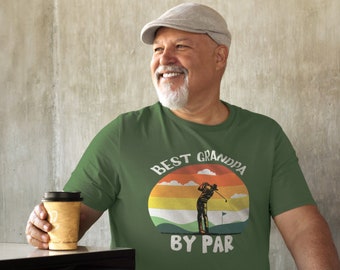 May include: Green t-shirt with a retro-style graphic of a golfer and the text "Best Grandpa By Par".