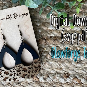 May include: A pair of black and brown wooden earrings with a leopard print design. The earrings are on a wooden display card with the text "Blackburn Rd. Designs" and "Digital Download (svg/pdf) Glowforge Tested".