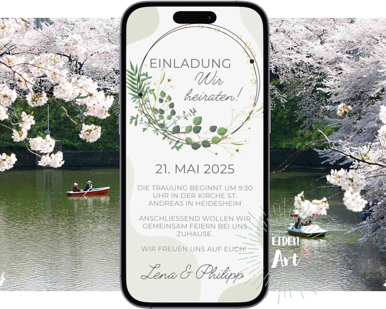 May include: A digital invitation on a smartphone screen with a green floral wreath and the text "EINLADUNG Wir heiraten! 21. MAI 2025 DIE TRAUUNG BEGINNT UM 9:30 UHR IN DER KIRCHE ST. ANDREAS IN HEIDESHEIM ANSCHLIESSEND WOLLEN WIR GEMEINSAM FEIERN BEI UNS ZUHAUSE WIR FREUEN UNS AUF EUCH! Lena & Philipp"