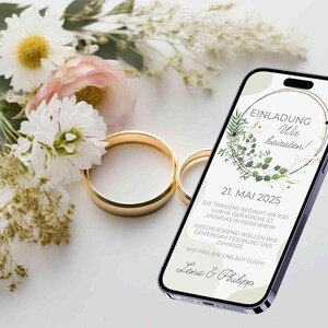 May include: A wedding invitation on a smartphone screen with a green floral design and the text "EINLADUNG Wir heiraten! 21. MAI 2025 DIE TRAUUNG BEGINNT UM 9:30 UHR IN DER KIRCHE ST. ANDREAS IN HEIDESHEIM ANSCHLIESSEND WOLLEN WIR GEMEINSAM FEIERN BEI UNS ZUHAUSE WIR FREUEN UNS AUF EUCH Lena & Philipp"