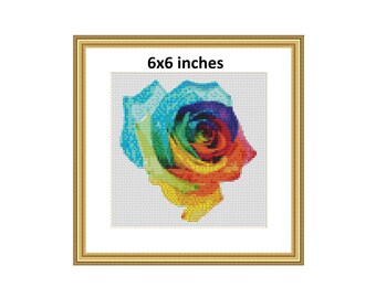 May include: A rainbow colored rose with a white background. The image is framed in gold and the text "6x6 inches" is printed below the rose.