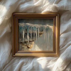 May include: A framed landscape painting featuring a cliff with snow and long icicles. The artwork is set in a gold-colored frame. The icicles are a light blue color, and the snow is white.