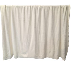 Full width view of hemp cotton jersey fabric hanging naturally
