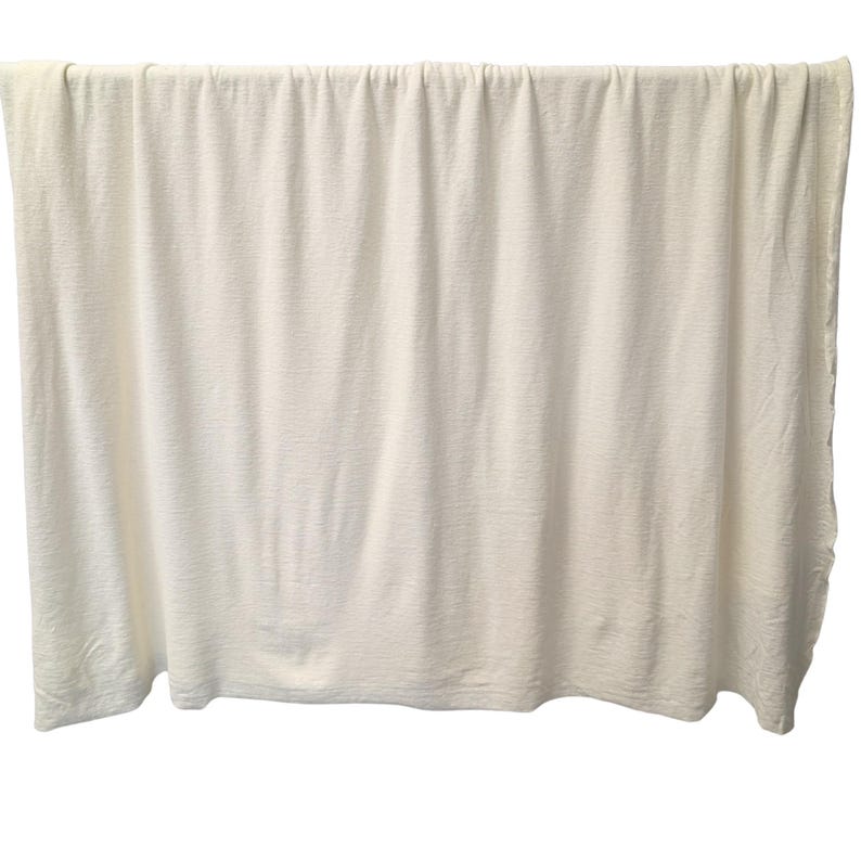 Full width view of hemp cotton jersey fabric hanging naturally