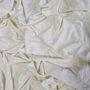 Natural hemp cotton jersey fabric with soft drape and breathable texture
