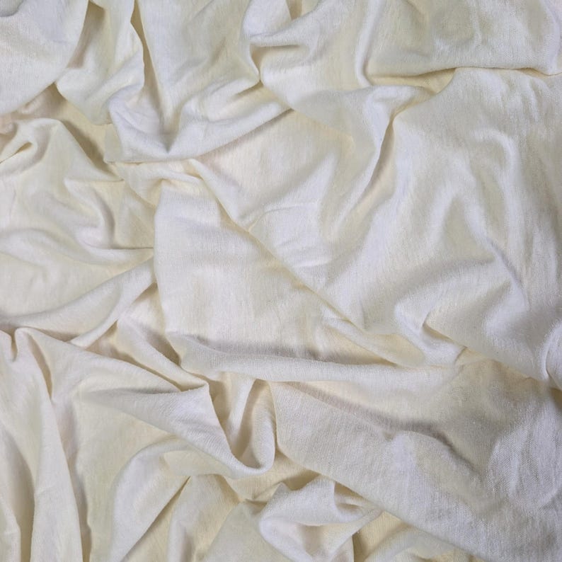 Natural hemp cotton jersey fabric with soft drape and breathable texture