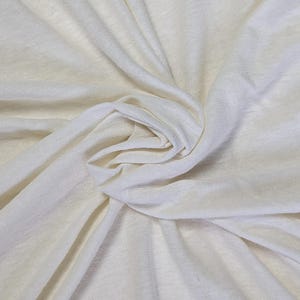 Close-up of organic hemp cotton jersey fabric showing stretch and softness