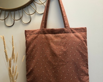 Pink fabric tote bag with flowers
